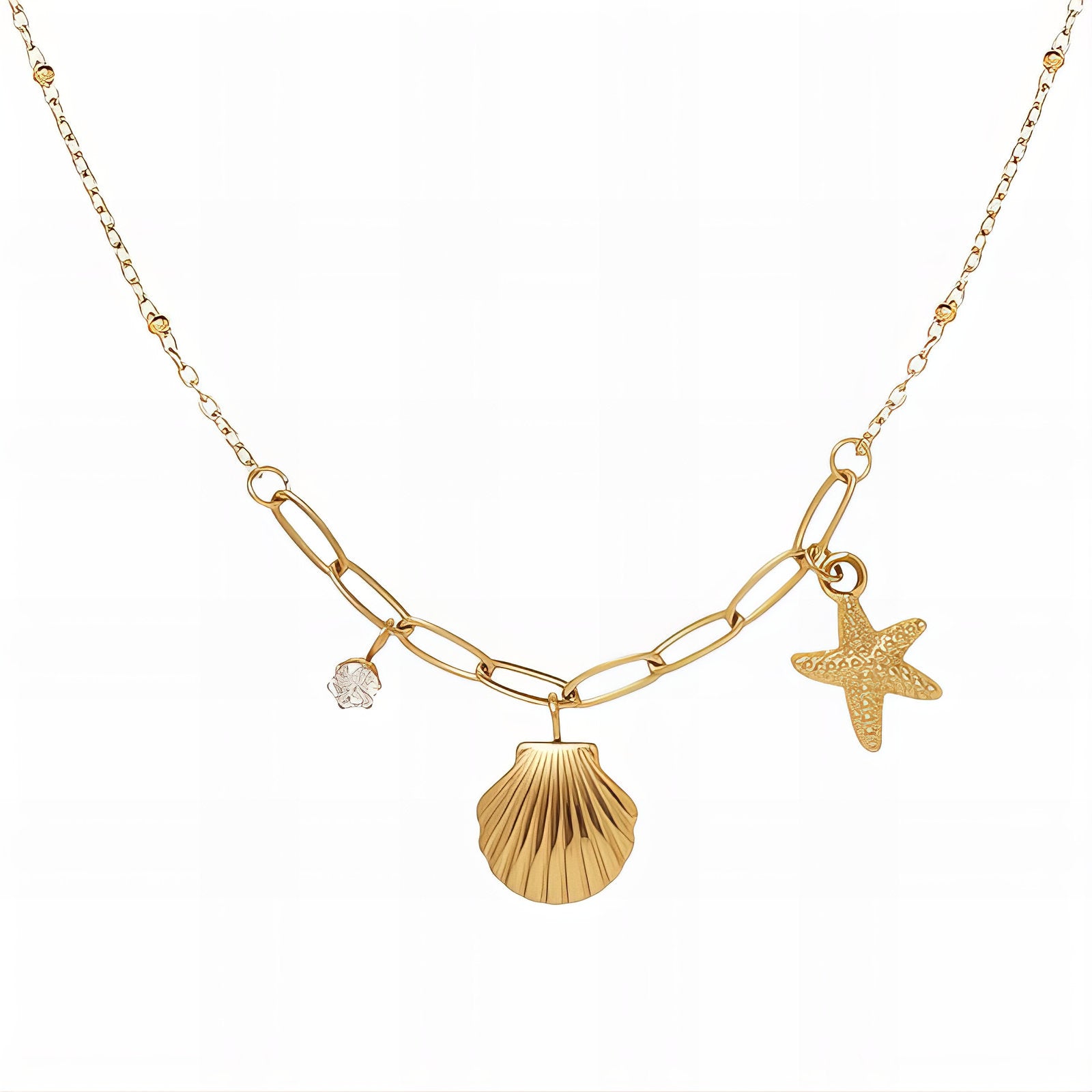 Gold shell pendant necklace with starfish and crystal charm on a mixed-link chain