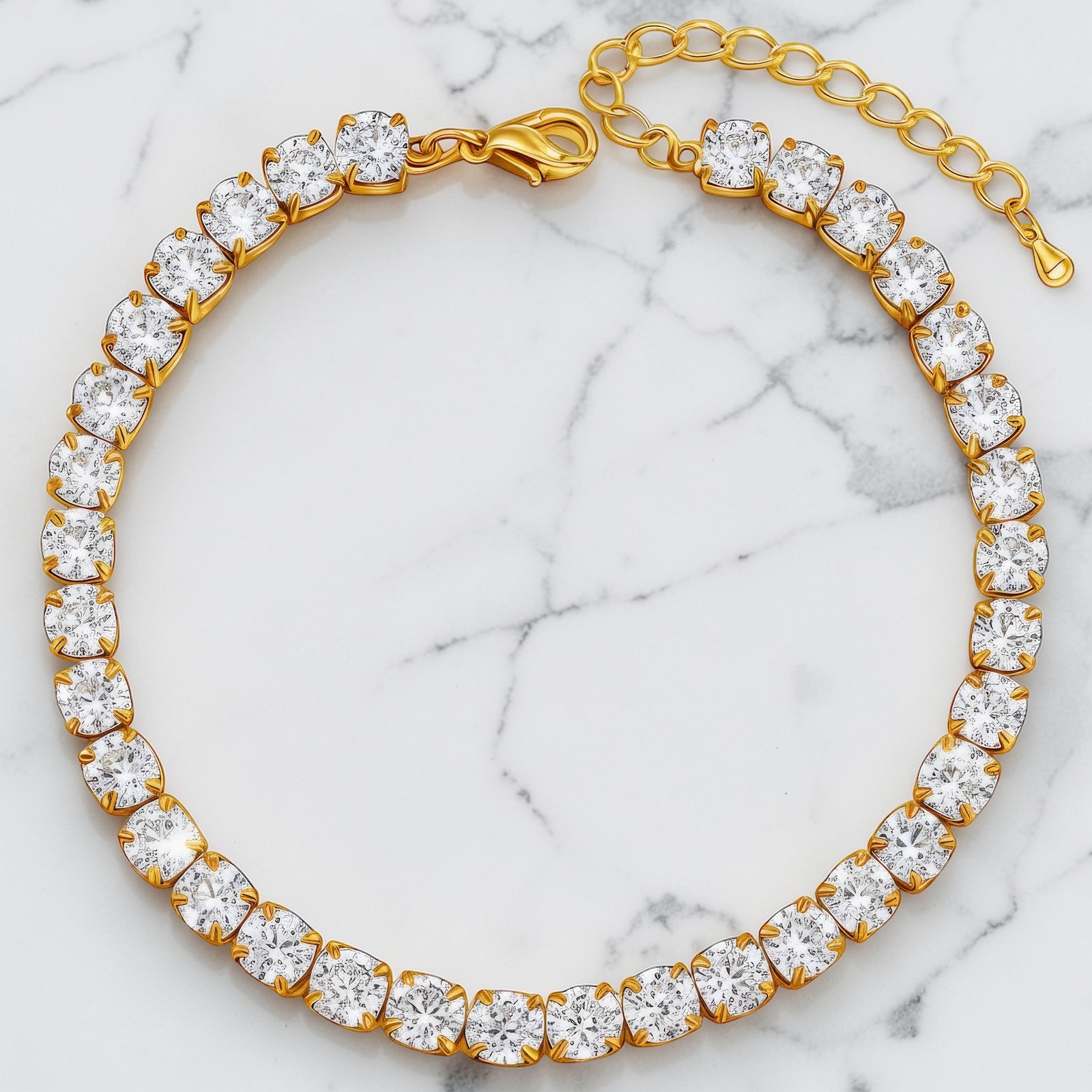 Gold tennis bracelet with a full row of clear cubic zirconia stones and a lobster clasp closure.