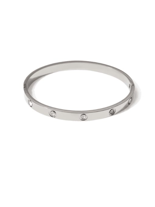 Silver-toned bangle bracelet with small crystal accents set around the band