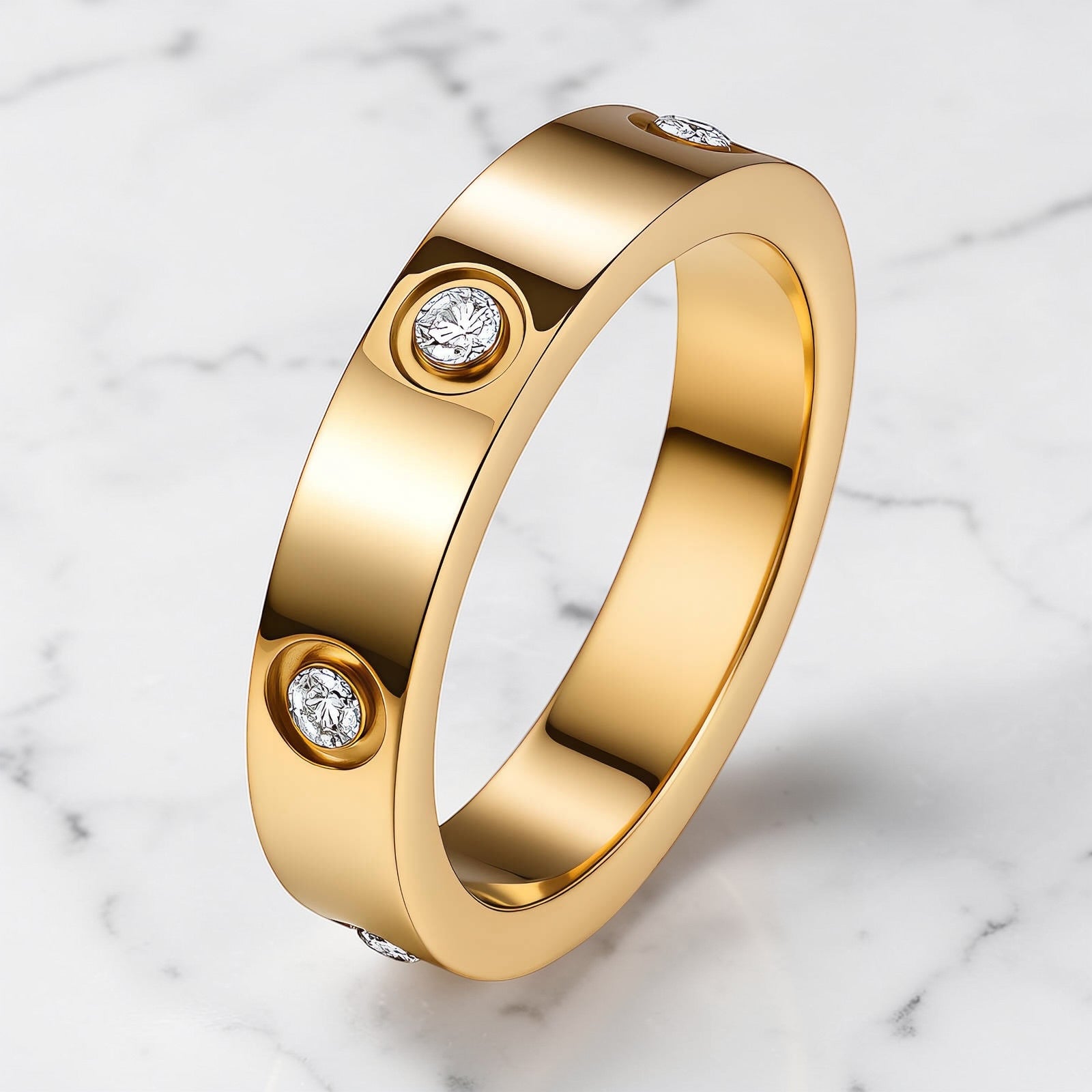 Gold band ring with bezel-set clear crystal accents and a polished finish