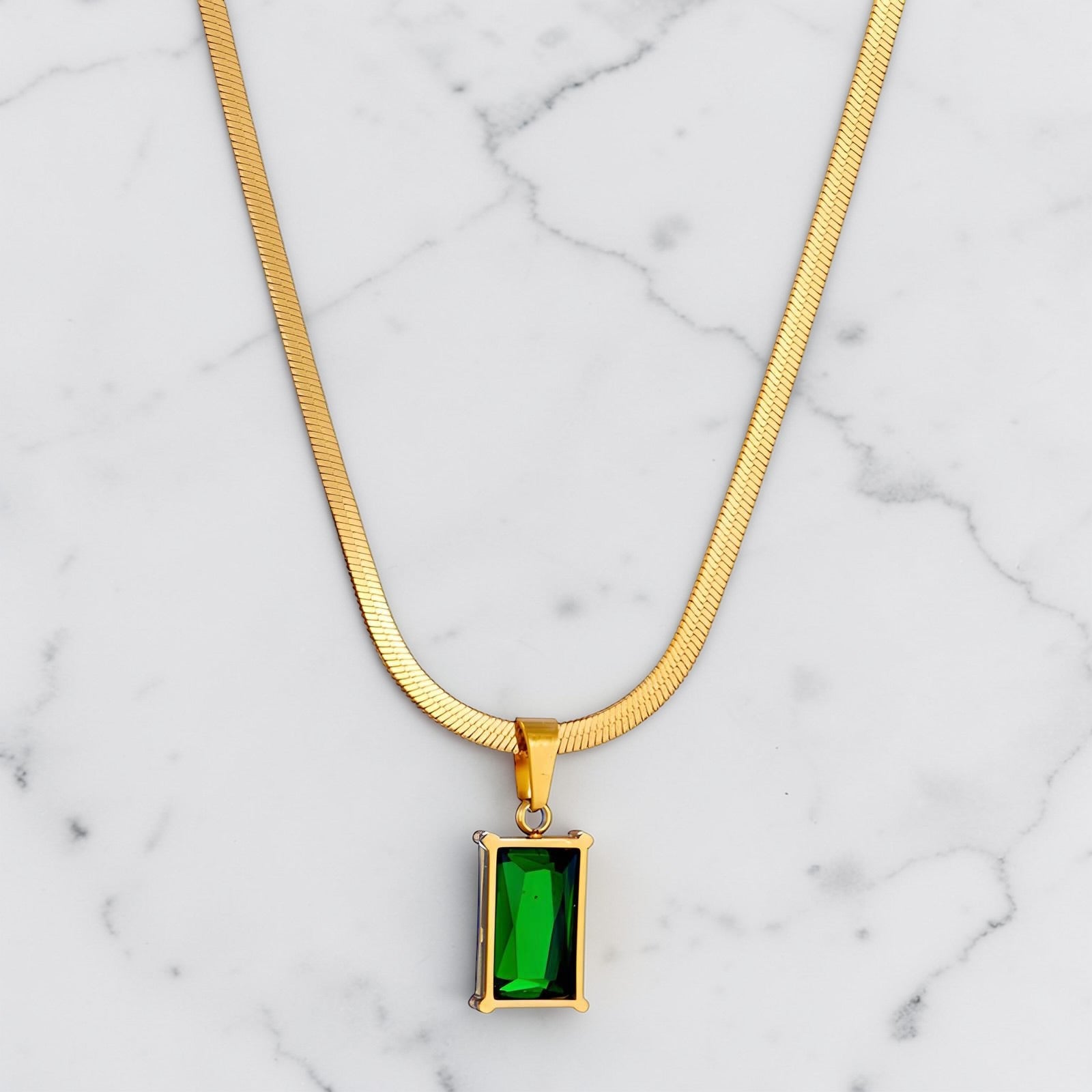 Emerald Prism Necklace with gold chain and rectangular emerald green stone pendant