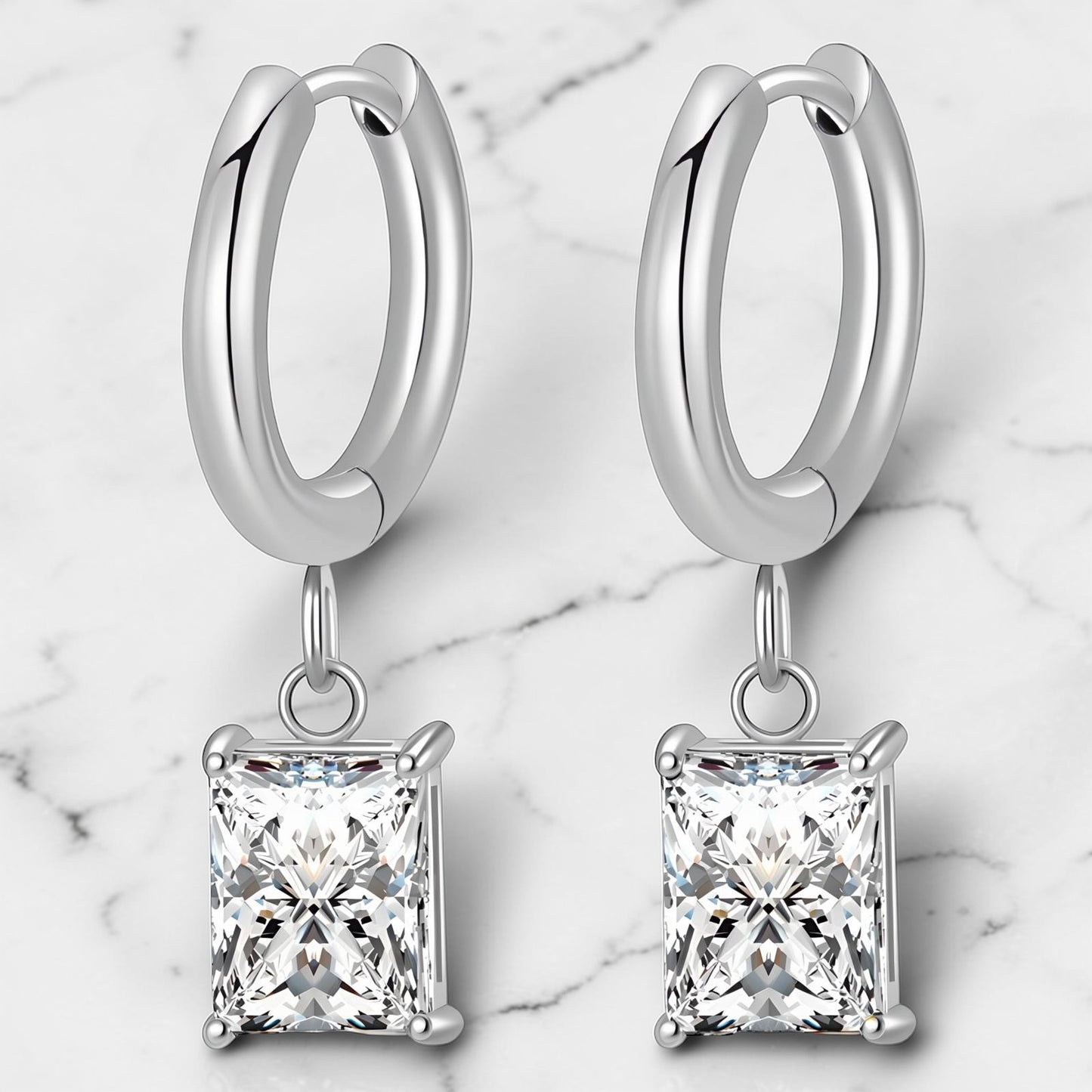 Silver hoop earrings with square-cut clear cubic zirconia drop charms.