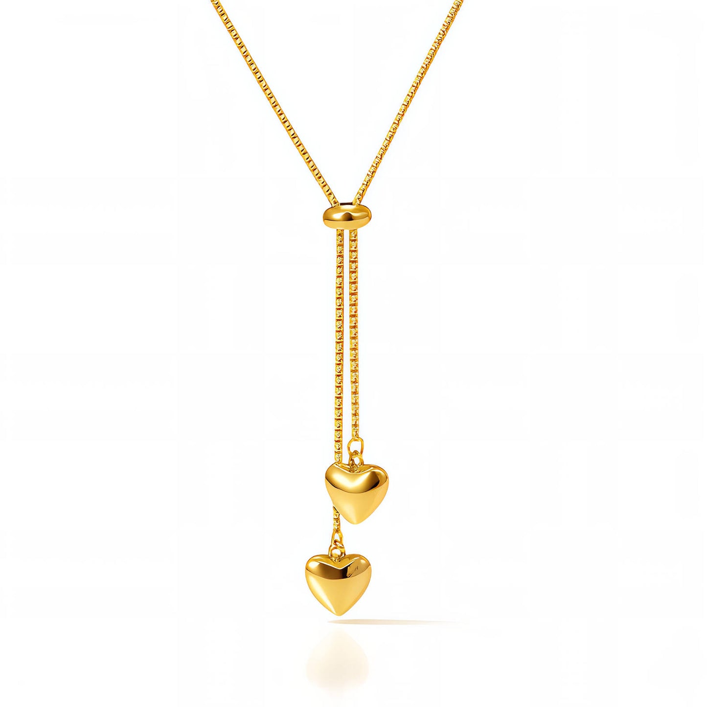 Gold adjustable necklace with two polished heart charms arranged in a vertical drop design.