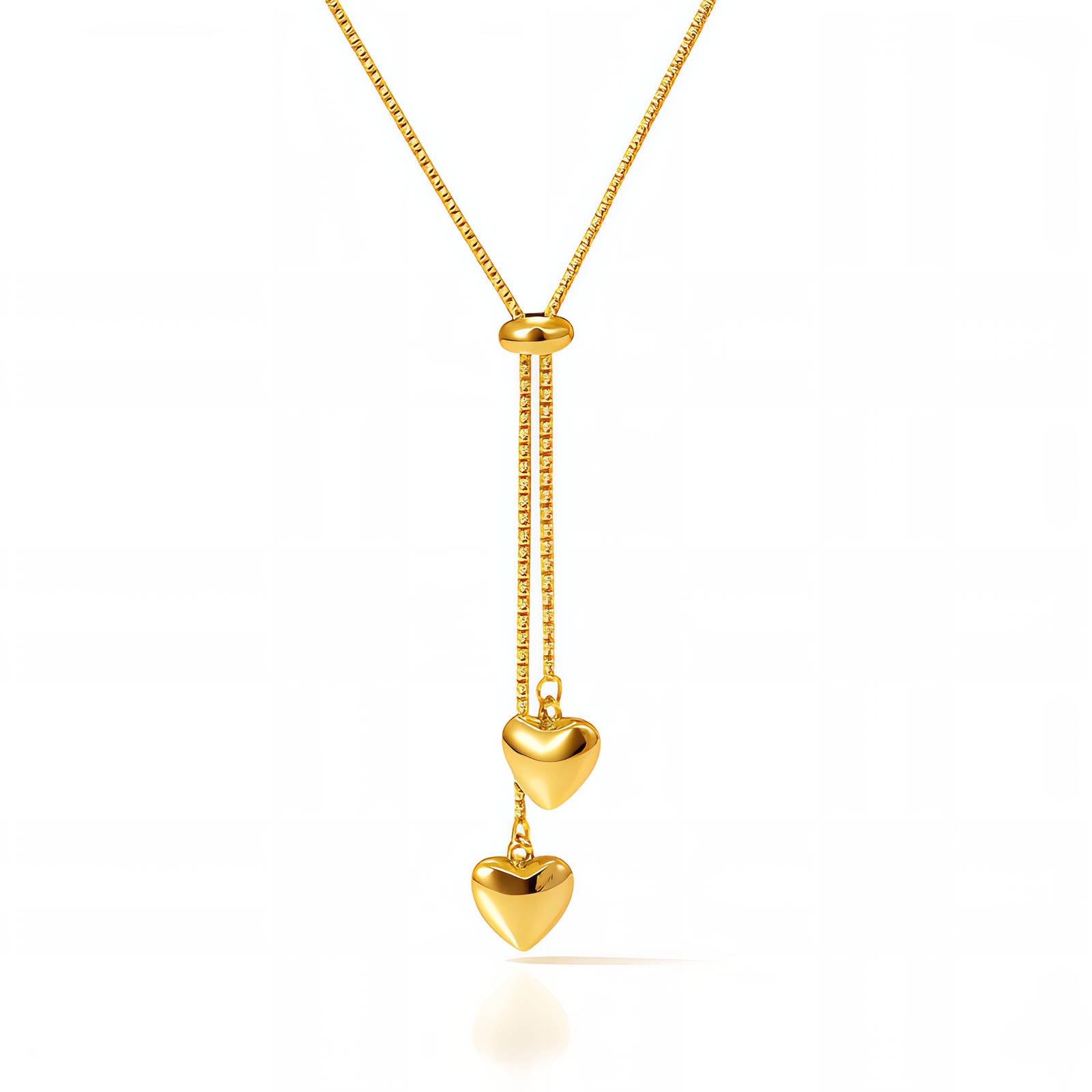 Gold adjustable necklace with two polished heart charms arranged in a vertical drop design.