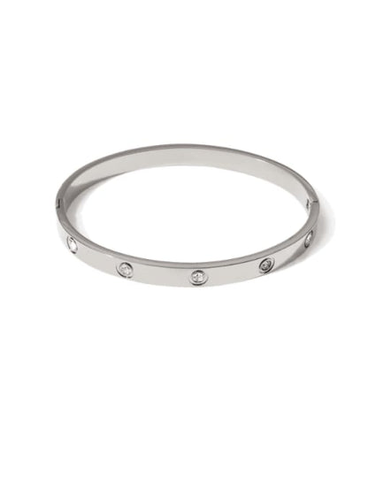Silver-toned bangle bracelet with small crystal accents set around the band