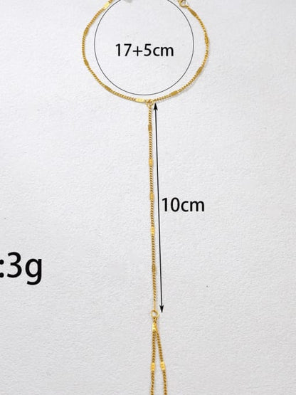 Minimal gold Mira handchain with delicate chain connecting wrist bracelet to finger loop by Rayka & Co.