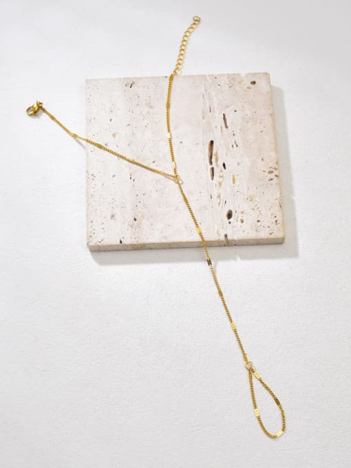 Minimal gold Mira handchain with delicate chain connecting wrist bracelet to finger loop by Rayka & Co.