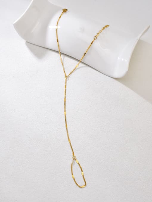 Minimal gold Mira handchain with delicate chain connecting wrist bracelet to finger loop by Rayka & Co.