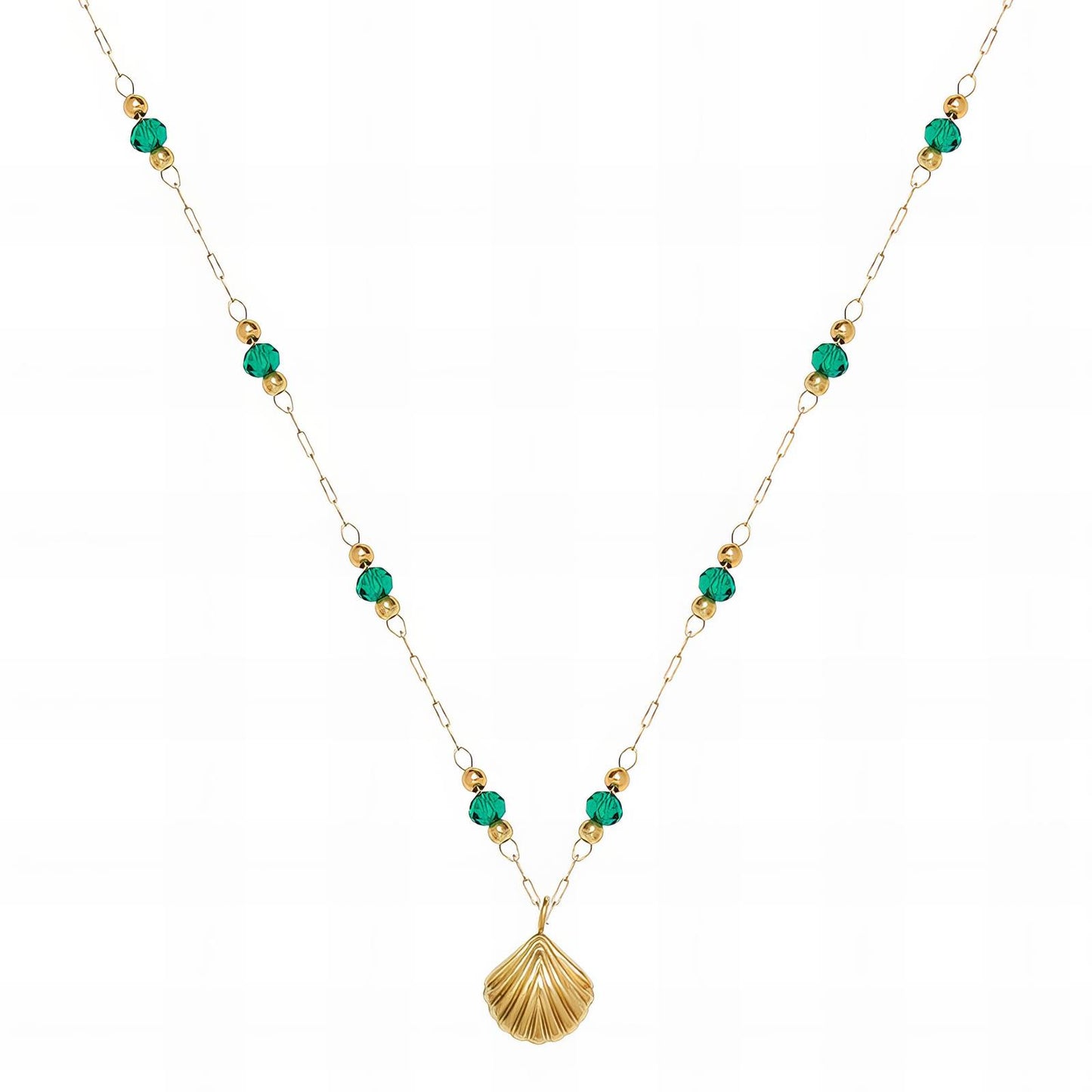 Gold beaded necklace with green accents and a shell-shaped pendant on a delicate chain