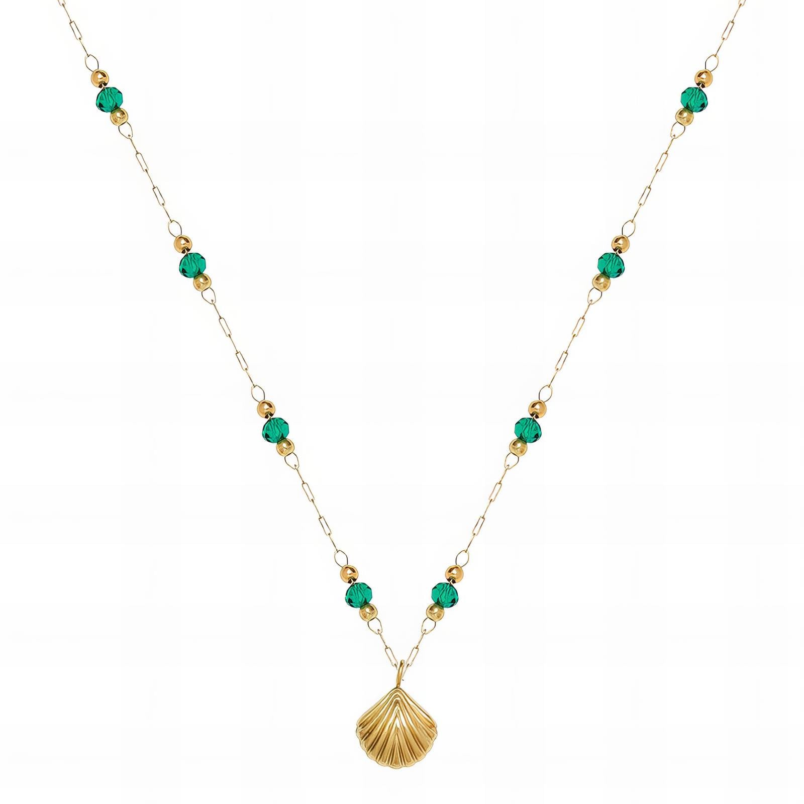 Gold beaded necklace with green accents and a shell-shaped pendant on a delicate chain
